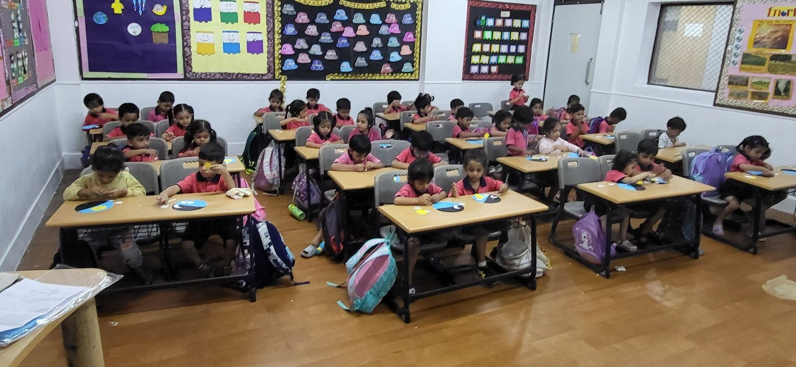 Children looking at a globe in a library